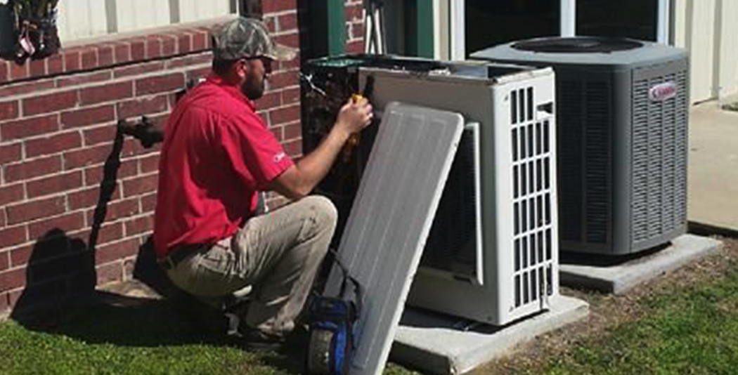 Bobby repairing an HVAC unit in Nacogdoches County, TX